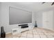 Cozy room with a large screen and projector, comfortable carpet, and a sleek entertainment center at 10106 Silverling Dr, Waxhaw, NC 28173