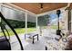 Relaxing covered patio with screen shades, ceiling fan, outdoor furniture, and view of the backyard at 10106 Silverling Dr, Waxhaw, NC 28173