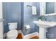Stylish powder room with pedestal sink and modern fixtures at 10106 Silverling Dr, Waxhaw, NC 28173
