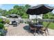 Expansive backyard featuring a patio with outdoor seating, grill, and lush green lawn at 1013 Nez Perce Ln, Monroe, NC 28110