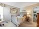 Neutral bedroom featuring a twin bed, art on the walls and access to the rest of the home at 1013 Nez Perce Ln, Monroe, NC 28110