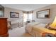 Neutral bedroom featuring a twin bed, art on the walls and a desk for a great work space at 1013 Nez Perce Ln, Monroe, NC 28110