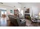 Cozy living room featuring a fireplace, comfortable seating, and wood flooring at 1013 Nez Perce Ln, Monroe, NC 28110