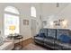 Bright living room area featuring lots of natural light and comfortable leather seating at 1013 Nez Perce Ln, Monroe, NC 28110