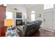 Inviting living area with fireplace, wood floors, and plenty of natural light at 1013 Nez Perce Ln, Monroe, NC 28110