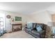Comfortable living room with a cozy leather reclining sofa and quaint decor at 1013 Nez Perce Ln, Monroe, NC 28110