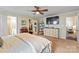Spacious main bedroom with a ceiling fan, carpeted floors and a walk in closet for plenty of storage at 1013 Nez Perce Ln, Monroe, NC 28110