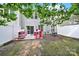 Cozy backyard with a small patio and a pink playhouse at 10135 Blakeney Preserve Dr, Charlotte, NC 28277