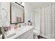 Bathroom featuring a single sink vanity and a shower with colorful curtain at 10135 Blakeney Preserve Dr, Charlotte, NC 28277