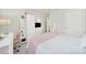 Well-lit bedroom with a bed, wardrobe, and built-in shelving unit at 10135 Blakeney Preserve Dr, Charlotte, NC 28277