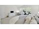 Bedroom featuring neutral carpet, white dresser, home gym and bright windows at 10135 Blakeney Preserve Dr, Charlotte, NC 28277