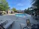 A sparkling community pool surrounded by lounge chairs and well-kept landscaping at 10135 Blakeney Preserve Dr, Charlotte, NC 28277