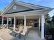 A community pool with an open-air building for seating and relaxing by the pool at 10135 Blakeney Preserve Dr, Charlotte, NC 28277