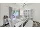 Dining room featuring modern decor, stylish furniture, and backyard view at 10135 Blakeney Preserve Dr, Charlotte, NC 28277