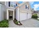 Charming home exterior with a welcoming front door, two-car garage, and well-maintained landscaping at 10135 Blakeney Preserve Dr, Charlotte, NC 28277