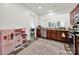 Kitchen with stainless steel appliances, wood cabinets and a toy kitchen at 10135 Blakeney Preserve Dr, Charlotte, NC 28277