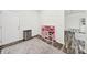 Playroom area with pink toy kitchen and stainless steel trash can at 10135 Blakeney Preserve Dr, Charlotte, NC 28277