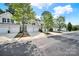 Street view showcases well-maintained homes, each with two-car garages at 10135 Blakeney Preserve Dr, Charlotte, NC 28277
