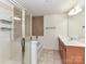 Primary bathroom features a glass-enclosed shower, soaking tub, and double sink vanity at 1016 Yellow Daisy Dr, Matthews, NC 28104