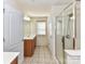 Bathroom features double doors, glass-enclosed shower, and a vanity sink at 1016 Yellow Daisy Dr, Matthews, NC 28104