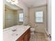 Bathroom with large vanity and mirror, and window, provides natural light at 1016 Yellow Daisy Dr, Matthews, NC 28104