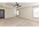 Spacious bedroom with neutral walls and carpeting boasts a ceiling fan and tray ceiling at 1016 Yellow Daisy Dr, Matthews, NC 28104
