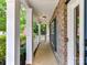 Charming front porch with white columns offers a welcoming entrance to the home at 1016 Yellow Daisy Dr, Matthews, NC 28104