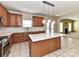 Bright kitchen featuring a center island, ample cabinet space, and modern appliances at 1016 Yellow Daisy Dr, Matthews, NC 28104