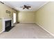 Cozy living room featuring a fireplace, neutral carpet, and plenty of space for relaxation at 1016 Yellow Daisy Dr, Matthews, NC 28104