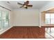 Bright living room with hardwood floors, a ceiling fan, and ample natural light at 1016 Yellow Daisy Dr, Matthews, NC 28104