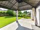 Gazebo on patio offers covered seating with views of the spacious, well-maintained yard at 1016 Yellow Daisy Dr, Matthews, NC 28104