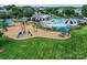 Aerial photo of community playground and pool area with picnic tables at 1016 Yellow Daisy Dr, Matthews, NC 28104