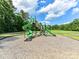 A vibrant community playground with slides, climbing structures, and safety mulch at 1016 Yellow Daisy Dr, Matthews, NC 28104