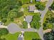 Top-down aerial view of real estate, showcasing tree coverage, lawns, landscaping, driveways, and neighborhood streets at 10621 Glenmac Rd, Charlotte, NC 28215