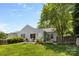 Spacious backyard featuring a patio set, lush lawn, and well-maintained landscaping at 10621 Glenmac Rd, Charlotte, NC 28215