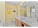 Bright bathroom with large vanity, ample counter space and yellow decor at 10621 Glenmac Rd, Charlotte, NC 28215
