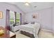 Bedroom with ample natural light, vaulted ceiling, and lavender walls at 10621 Glenmac Rd, Charlotte, NC 28215