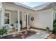 Close-up of a charming front porch with seating, pillars, and a well-maintained entrance at 10621 Glenmac Rd, Charlotte, NC 28215