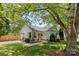 Attractive home with manicured front lawn, inviting porch seating, and a neatly edged walkway at 10621 Glenmac Rd, Charlotte, NC 28215