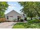 Quaint house with a manicured lawn, inviting front porch, and easy access to driveway at 10621 Glenmac Rd, Charlotte, NC 28215