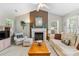 Bright living room with fireplace, neutral tones, and comfortable seating at 10621 Glenmac Rd, Charlotte, NC 28215
