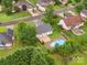 Aerial view of the home with a pool, deck, and beautifully landscaped backyard at 116 Birchwood Ct, Mount Holly, NC 28120
