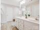 Bright bathroom with double vanity, white cabinets, and a separate shower at 116 Birchwood Ct, Mount Holly, NC 28120
