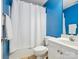 Bright bathroom featuring a white shower curtain, toilet, and vanity at 116 Birchwood Ct, Mount Holly, NC 28120
