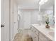 Bright bathroom featuring a double vanity with white cabinets and a separate shower at 116 Birchwood Ct, Mount Holly, NC 28120