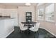 Bright breakfast nook features a round table with seating, a built-in shelf, and lots of natural light at 116 Birchwood Ct, Mount Holly, NC 28120