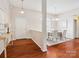 The foyer features wood floors, a dining area, a white door and a light beige wall paint at 116 Birchwood Ct, Mount Holly, NC 28120