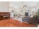Open living space with fireplace and piano at 116 Birchwood Ct, Mount Holly, NC 28120