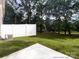 Large backyard with a white fence and lush trees, perfect for outdoor enjoyment at 12526 Susanna Dr, Charlotte, NC 28214