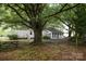 Expansive backyard featuring a large, mature tree offering plenty of shade at 1270 N Enochville Ave, China Grove, NC 28023
